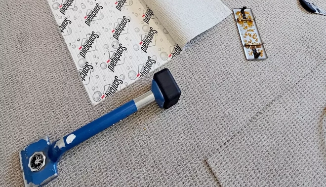 carpet installation with tools about photo